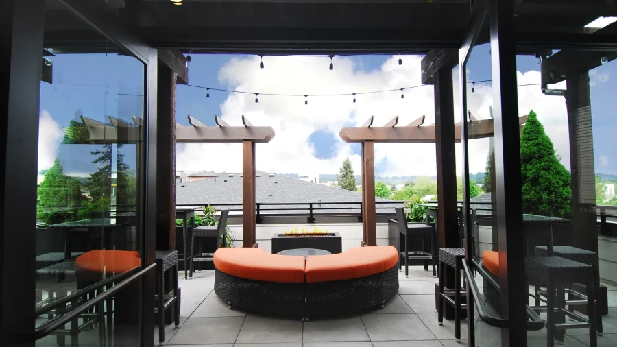 Covered rooftop lounge with fire pit seating